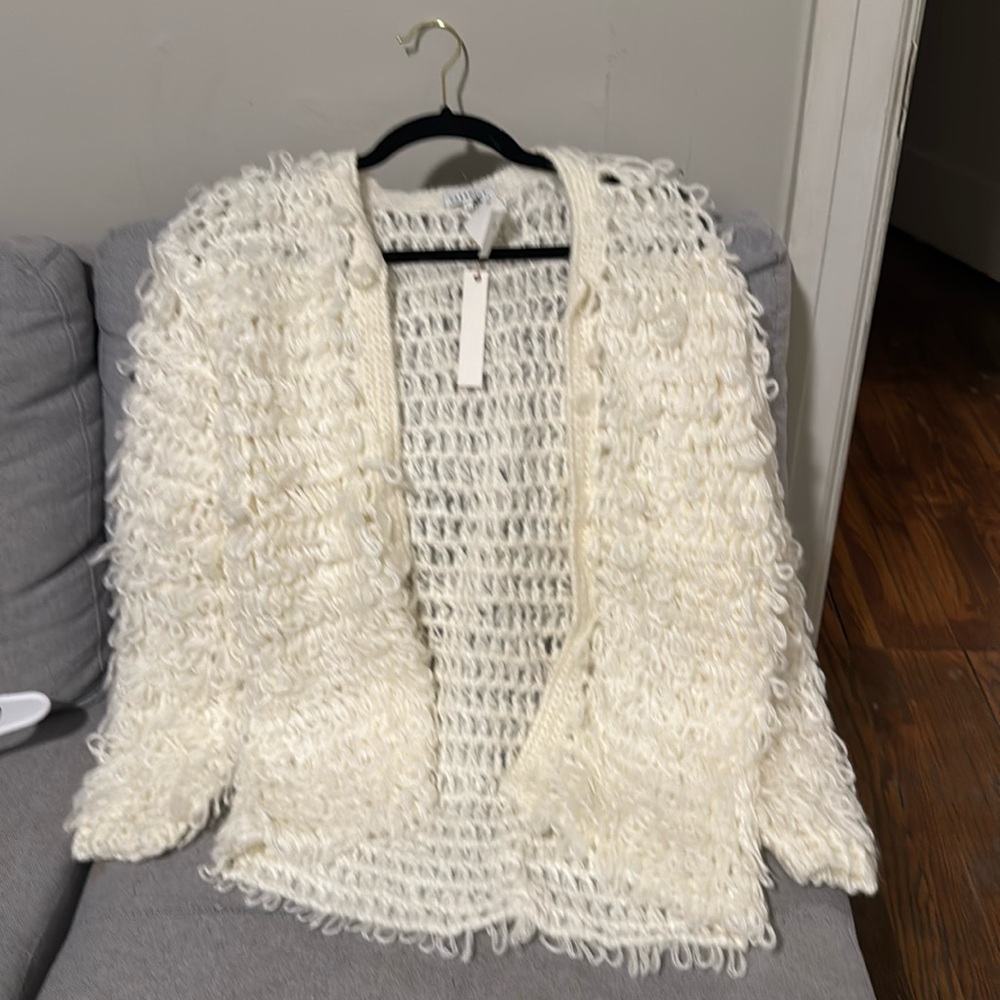 This is a cute , funky threaded cardigan in a size large